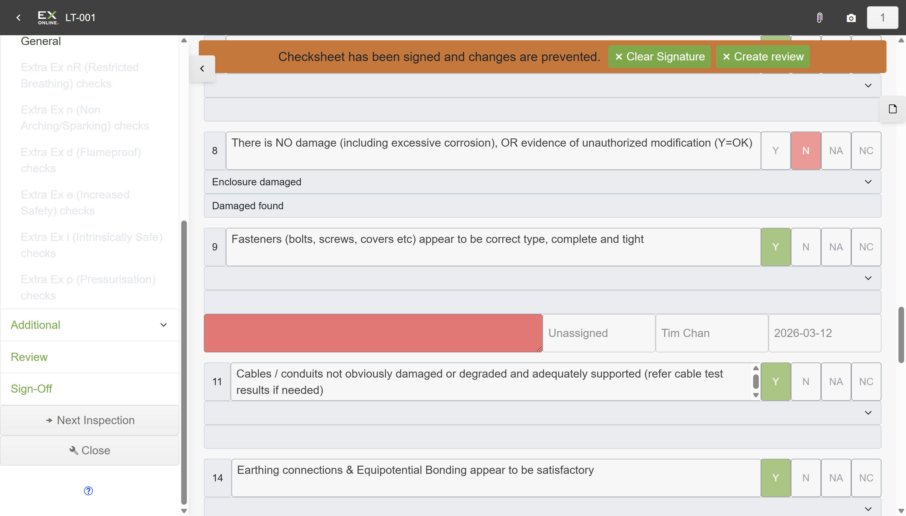 Signed check sheet with orange locked banner, question 8 marked N with Enclosure damaged